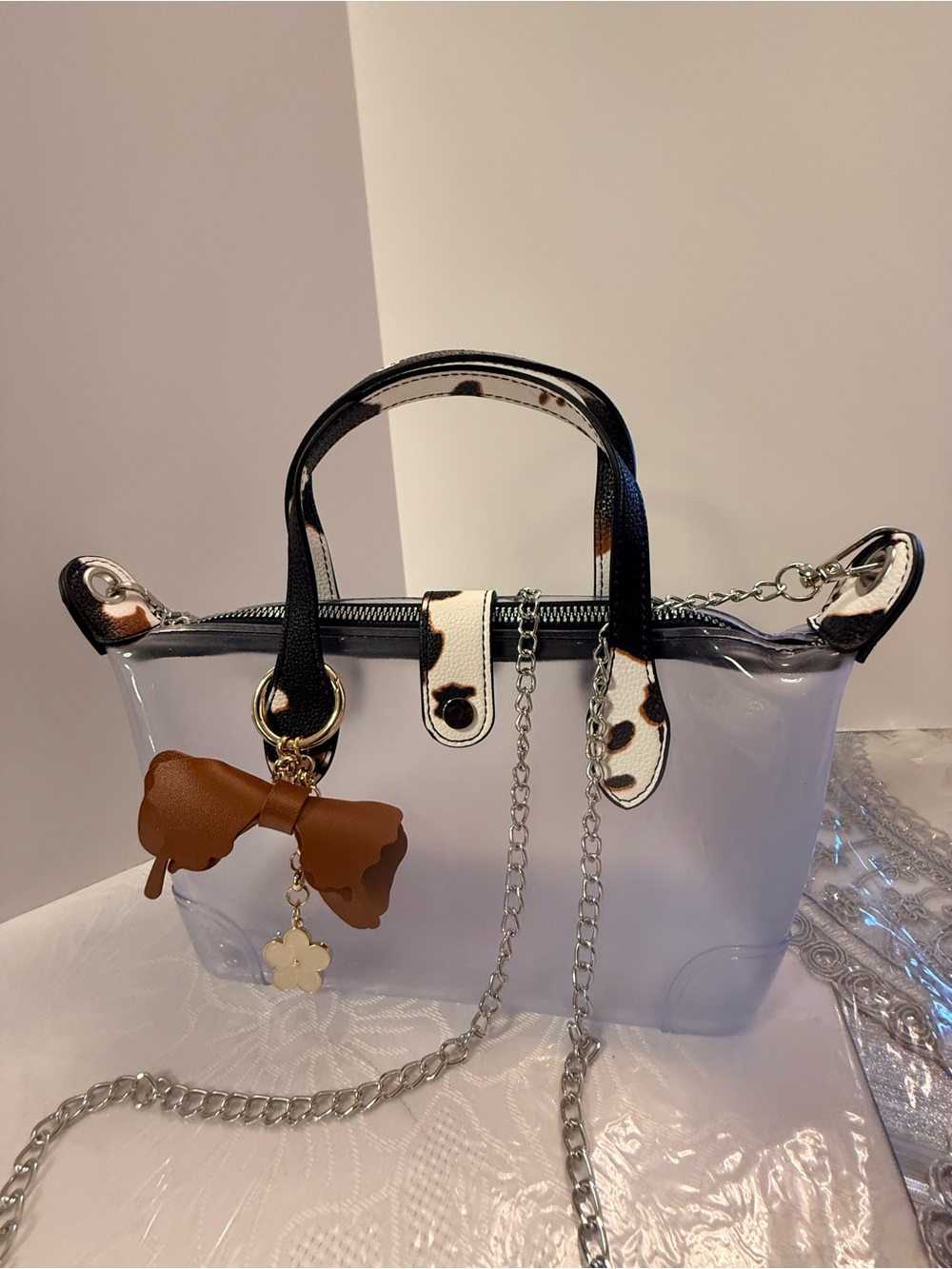 Clear Crossbody Handbag with Black Trim and Brown Bow Charm